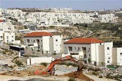 An&nbsp;excavator&nbsp;works&nbsp;near&nbsp;houses&nbsp;under&nbsp;construction&nbsp;in&nbsp;the&nbsp;West&nbsp;Bank&nbsp;Jewish&nbsp;settlement&nbsp;of&nbsp;Beitar&nbsp;Ilit,&nbsp;near&nbsp;Bethlehem&nbsp;March&nbsp;8,&nbsp;2010.&nbsp;REUTERS/Amir&nbsp;Cohen