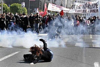 A&nbsp;demonstrator&nbsp;stumbles&nbsp;and&nbsp;falls&nbsp;during&nbsp;clashes&nbsp;with&nbsp;riot&nbsp;police&nbsp;in&nbsp;Athens.&nbsp;(AFP/Aris&nbsp;Messinis)