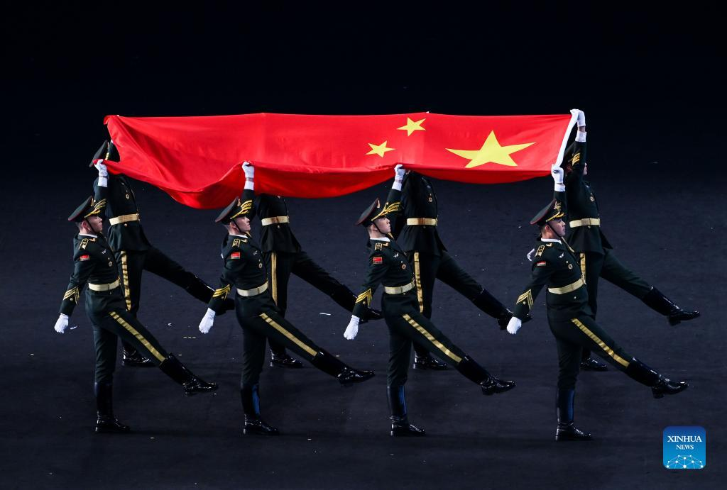 Flag bearers carry the Chinese national flag into the National Stadium during the opening ceremony of the Beijing 2022 Olympic Winter Games in Beijing, capital of China, Feb. 4, 2022. (Xinhua/Li Ziheng)